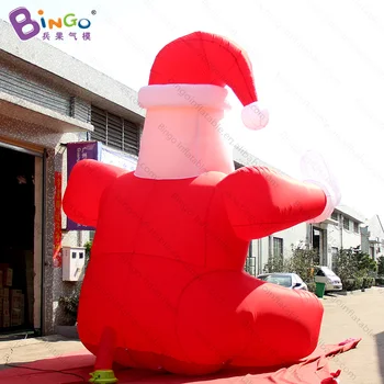 Decor de crăciun Gonflabil Stând Moș Crăciun De Vânzare / Exterior 5mH Fluturând Crăciun Bătrân Cu Logo-ul Personalizat - Jucarii